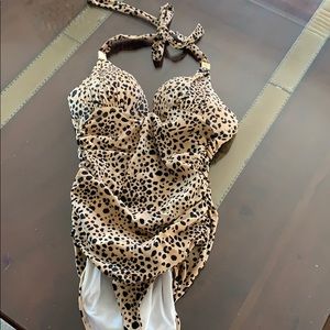 Victoria secret one pice swim suit.